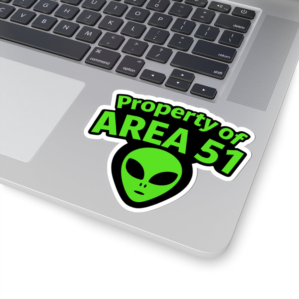Laptop with a 'Property of AREA 51' alien sticker on the palm rest area.