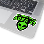 Laptop with a 'Property of AREA 51' alien sticker on the palm rest area.