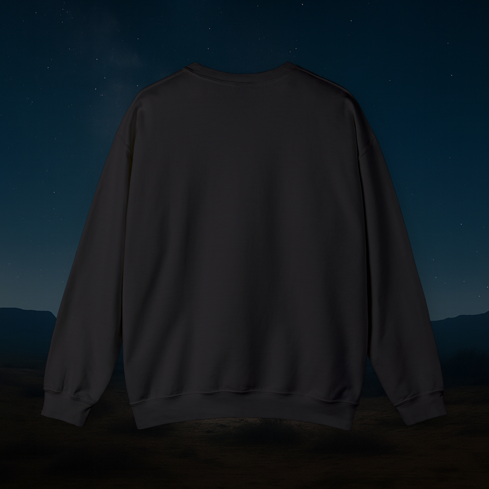 Black sweatshirt against a dark sky with stars